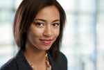 Horizontal headshot of an attractive african american business woman shot with shallow depth field.